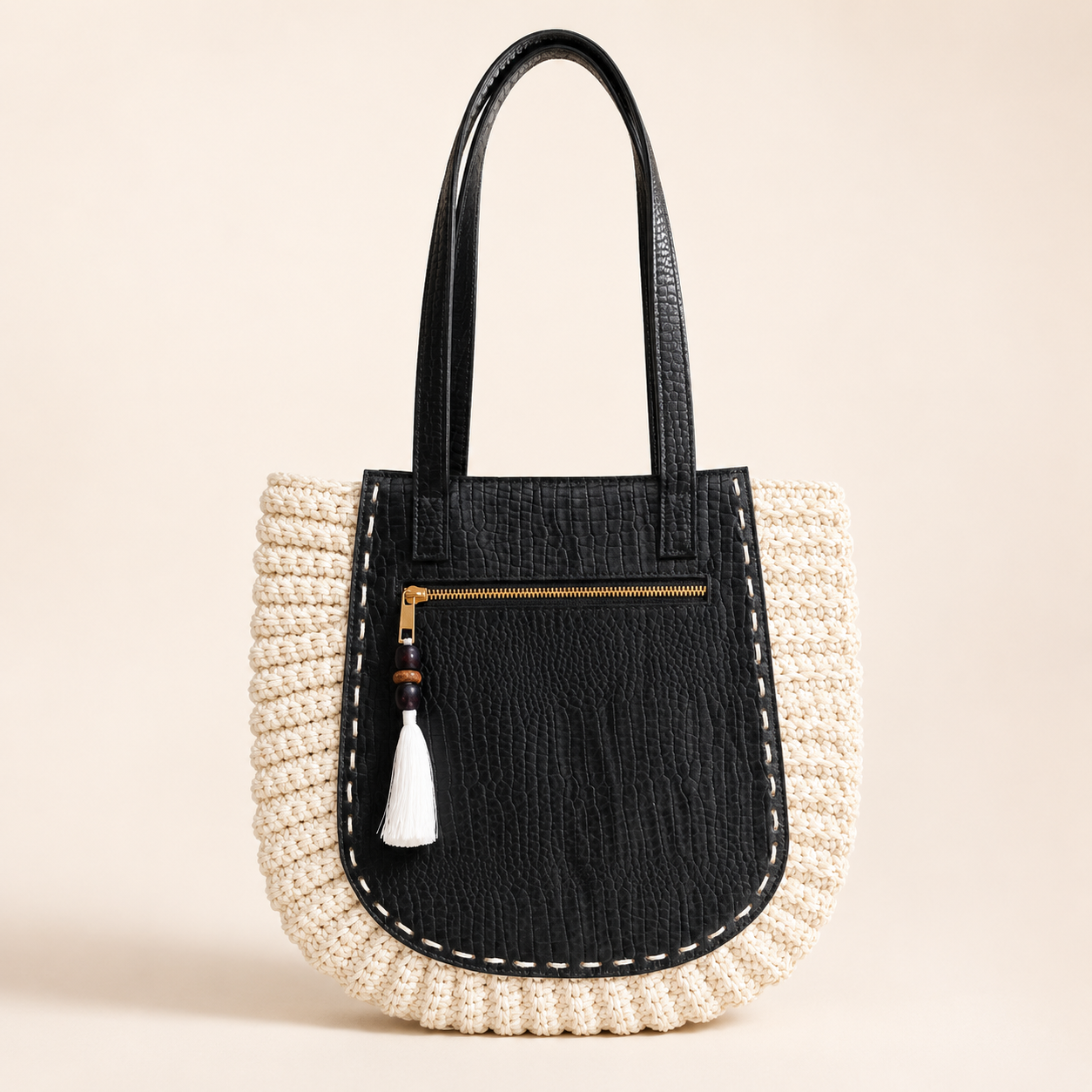 Ivory crochet tote with black leather front panel and white tassel